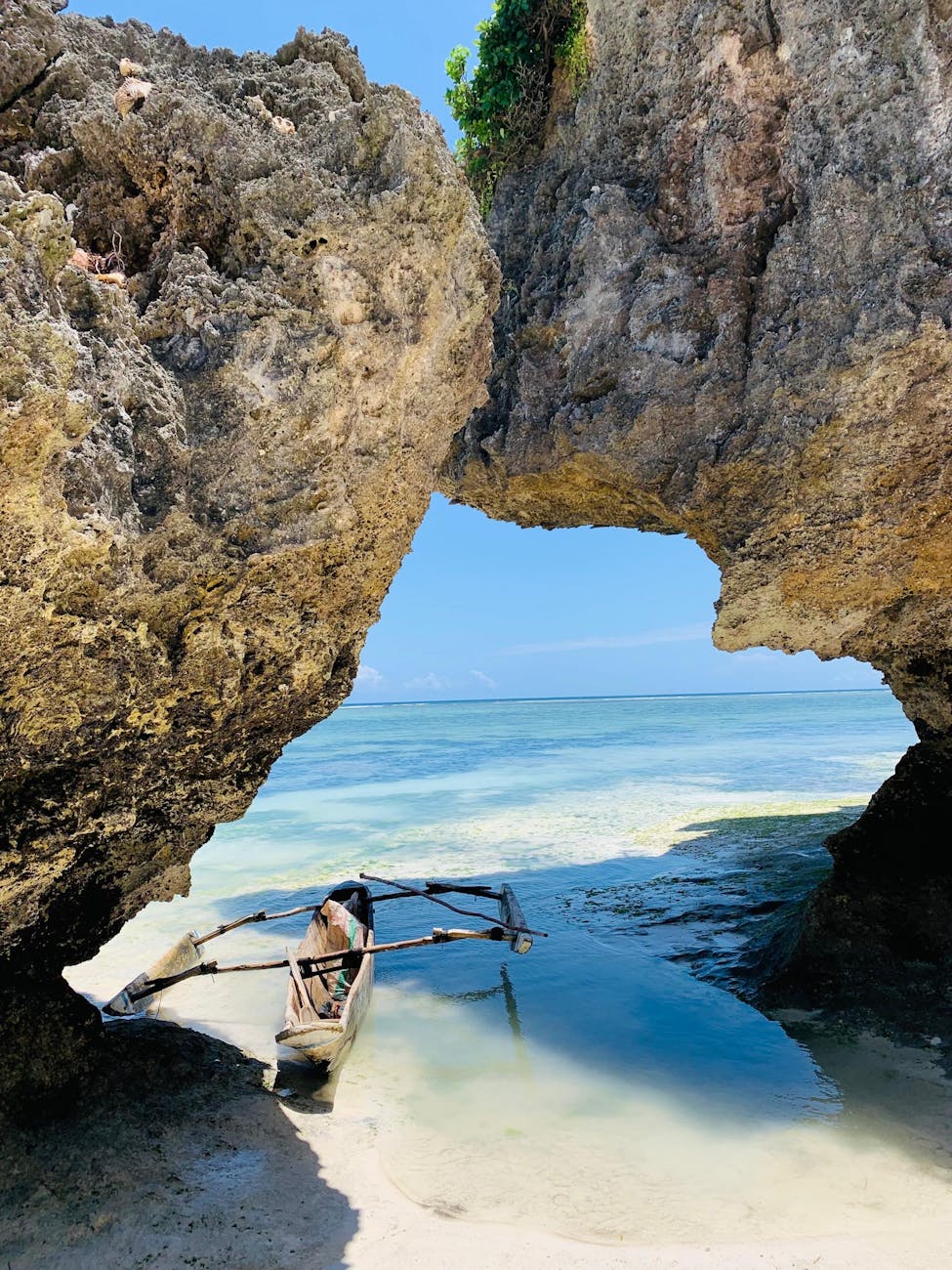 traditional boat in tropical beach cove